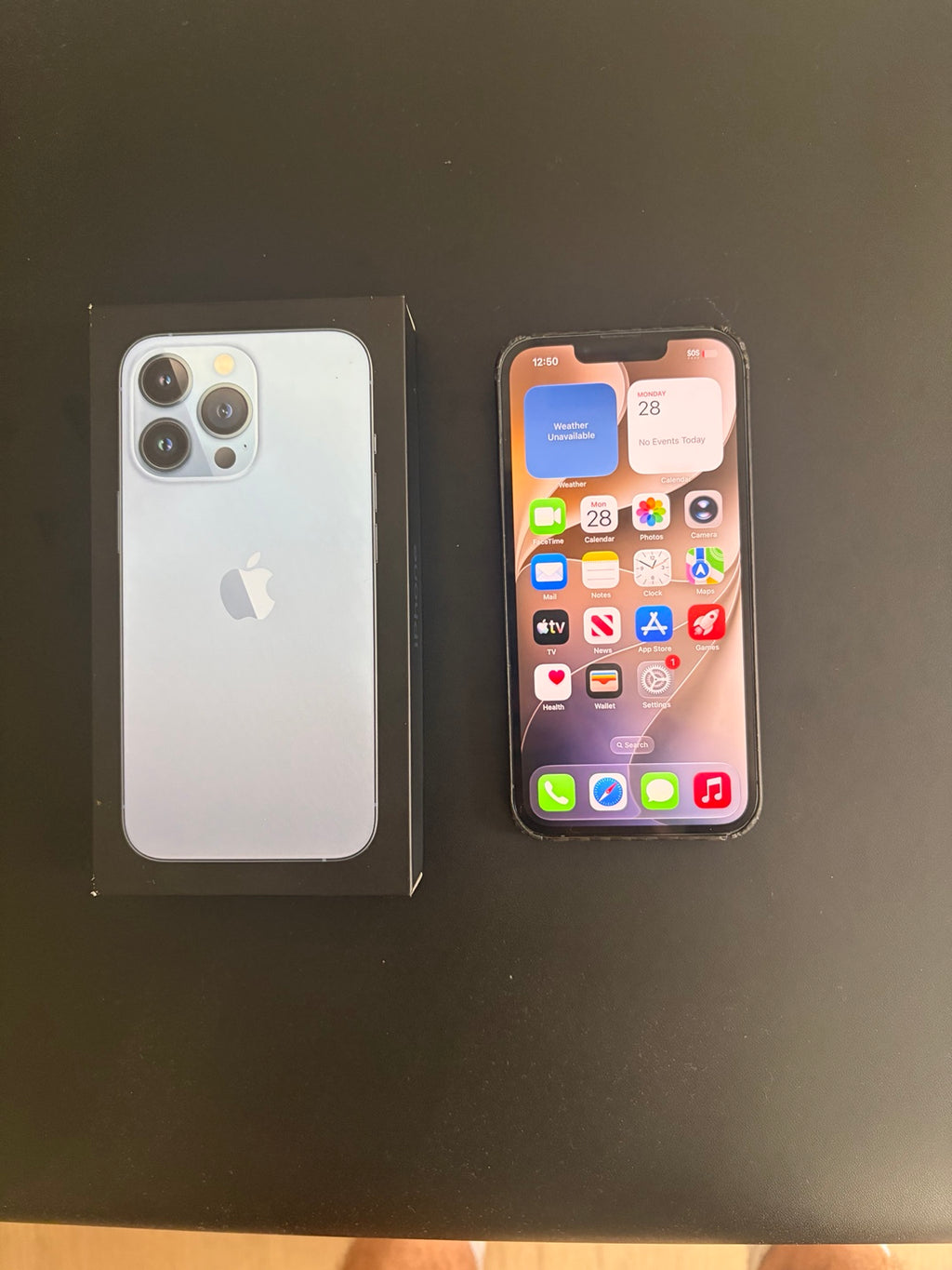 iPhone 13 Pro 256GB Sierra Blue front home screen with box