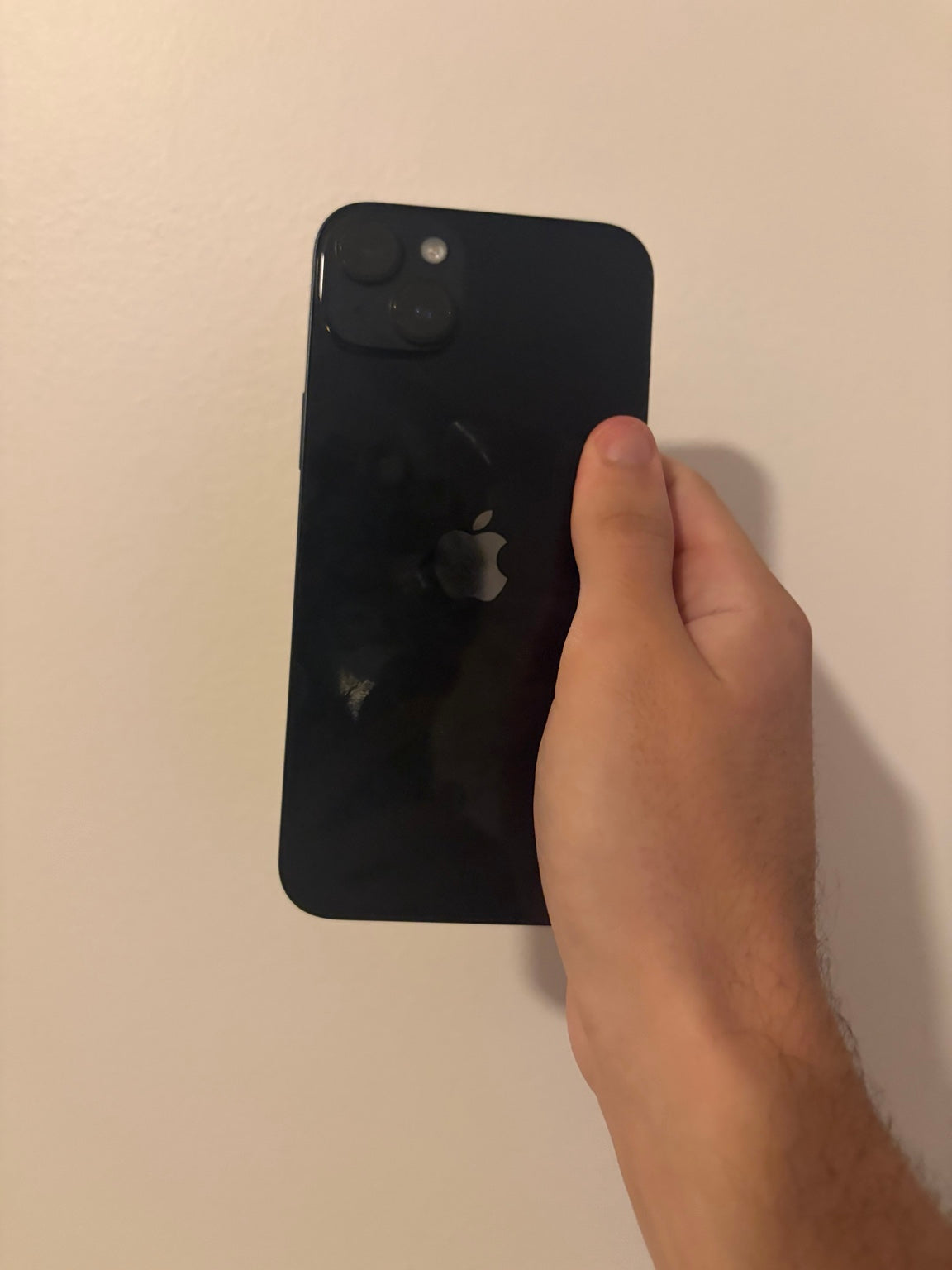 Back of iPhone 14 Plus Midnight showing Apple logo